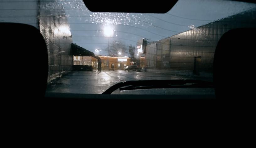 Night street seen from inside a car