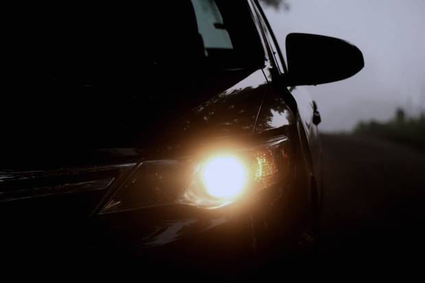 Amber indicator glowing on a dark car